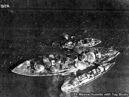 USS Massachusetts with Tug Boats