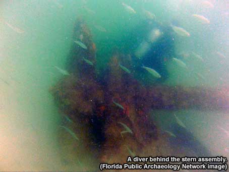 A diver behind the stern assembly